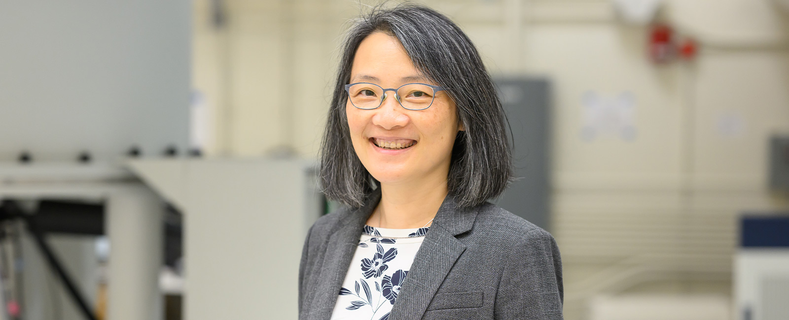 Professor Mei Hong smiles in her lab.