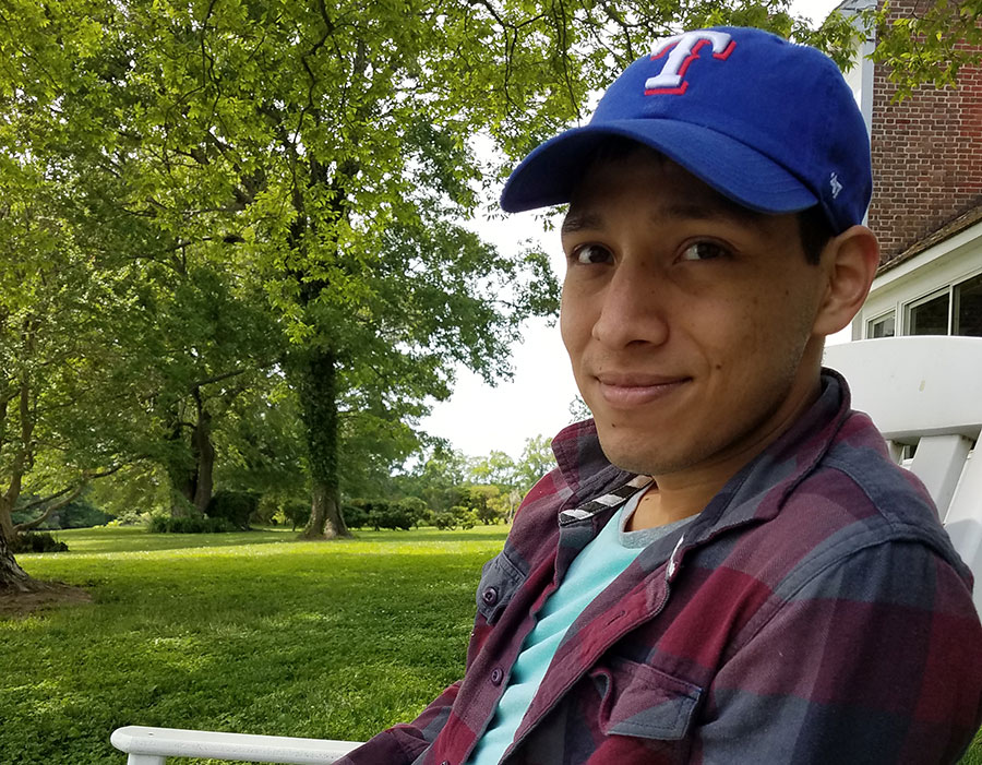 Raymundo Moya sits outside at MIT