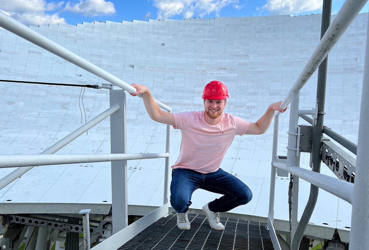 Zachary Fried smiles wearing a hard hat.