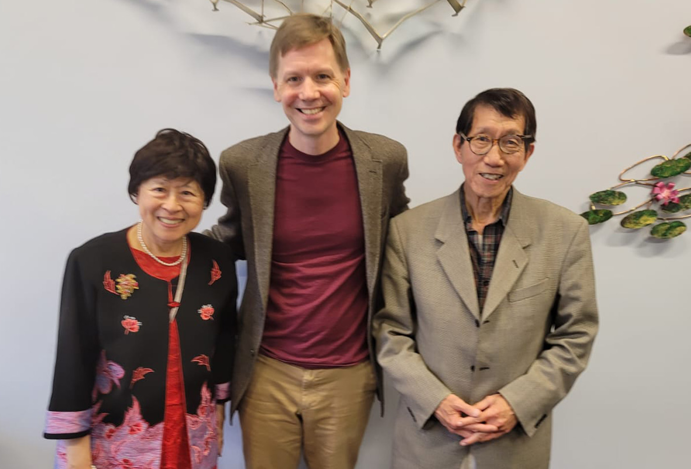 Deborah Chung, Department Head Troy Van Voorhis, and Lan Wong smile together in a row.