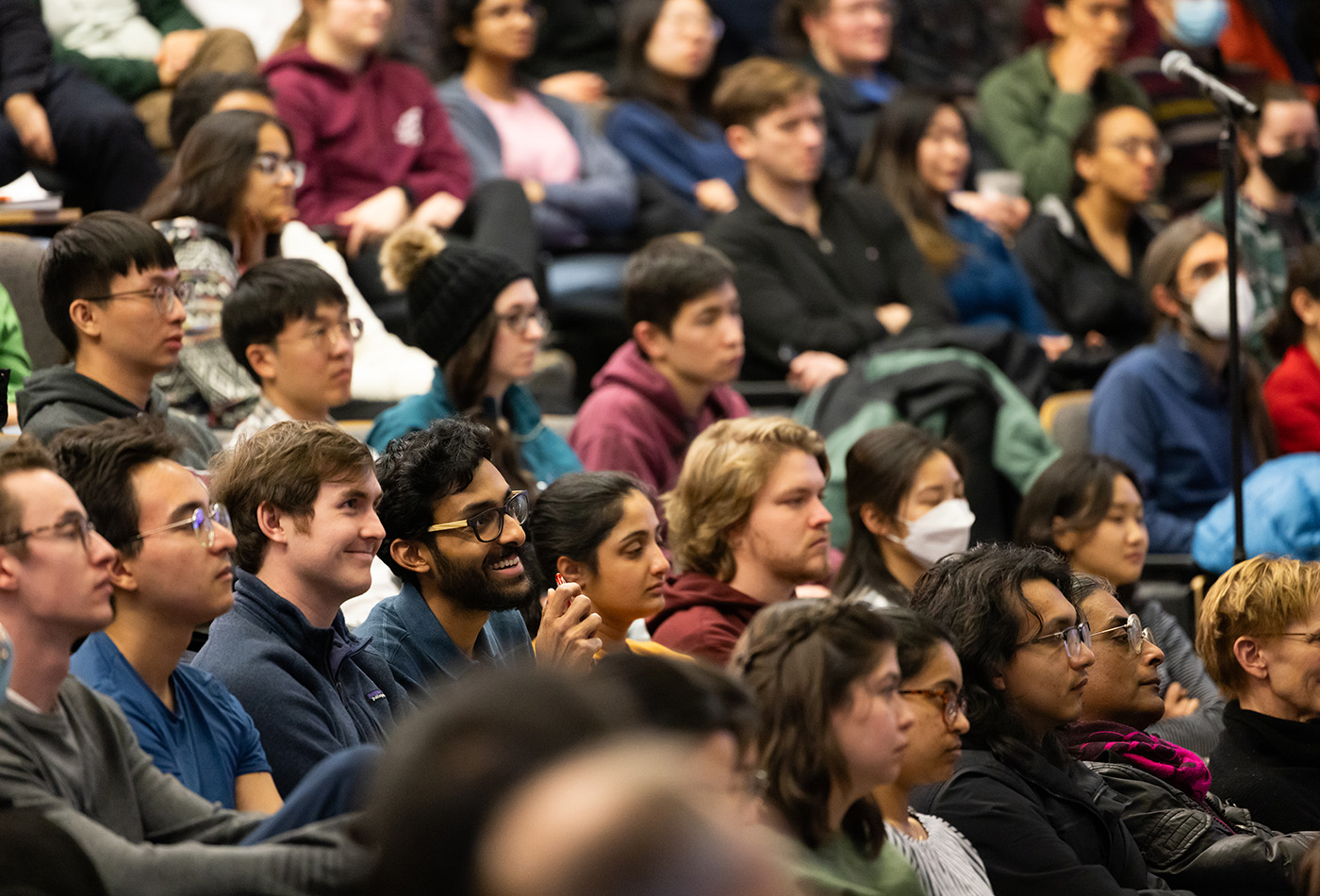 A crowd seated in a lecture hall.