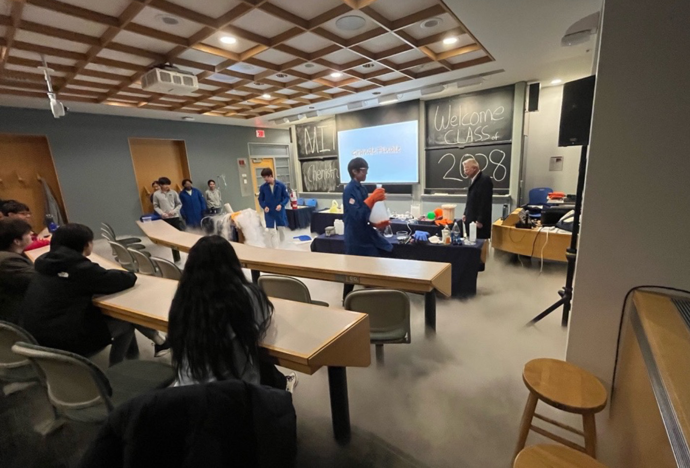 A group of students conduct magical experiments in a classroom.