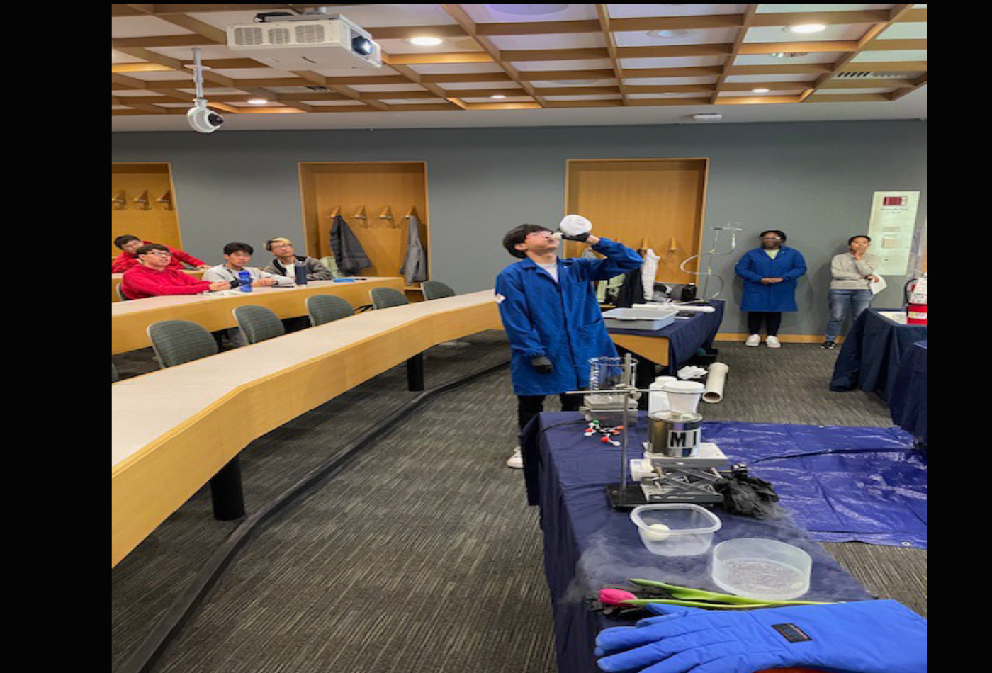 A group of students conduct magical experiments in a classroom.