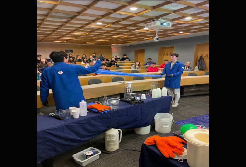 A group of students conduct magical experiments in a classroom.