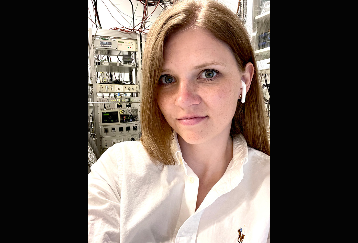 Gabi Wenzel smiles in front of laboratory.